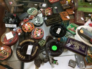 Cabinet of assorted tins